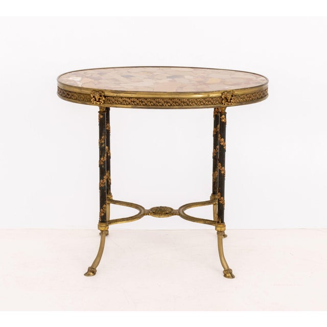 Louis XVI Style Brech d'Alep Marble Top and Gilt Metal Mounted Side Table, the oval top above hoof feet, signed "Hirch" to...