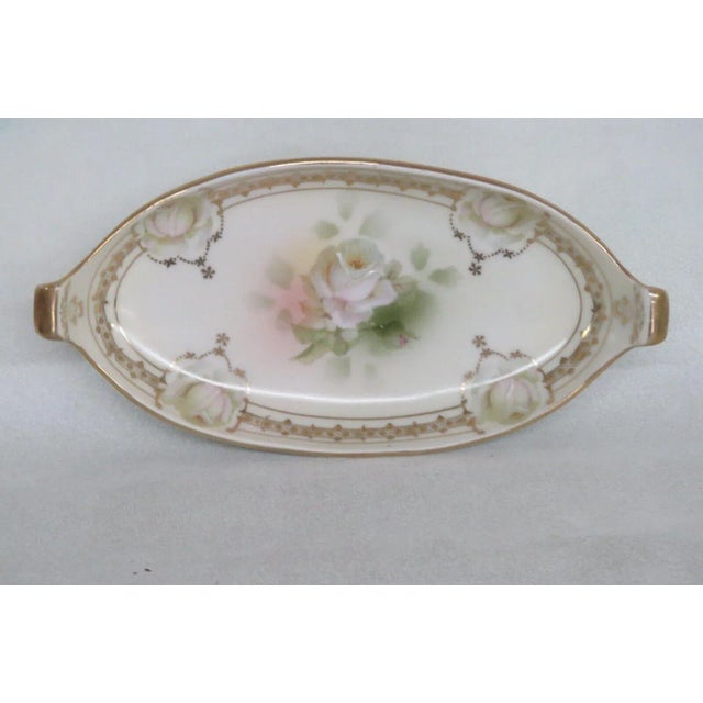 This lovely serving tray / dish is made of porcelain. This dish is stamped as being made by Royal Rudolstadt in Prussia /...