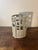 A sculptural 1960s mid-century modern ceramic planter featuring an architectural arrangement of square and circular cutout...