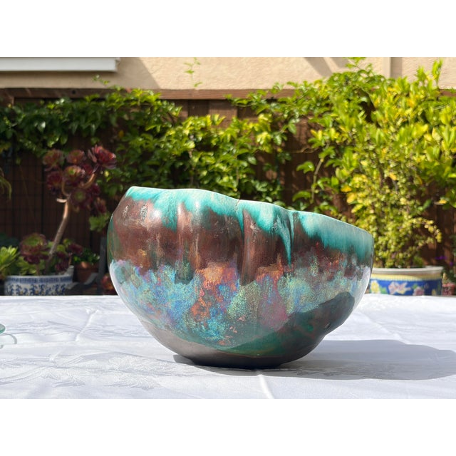 A striking 1970s California studio craft centerpiece bowl by renowned ceramic artist Tony Evans (1942–2009). Celebrated...