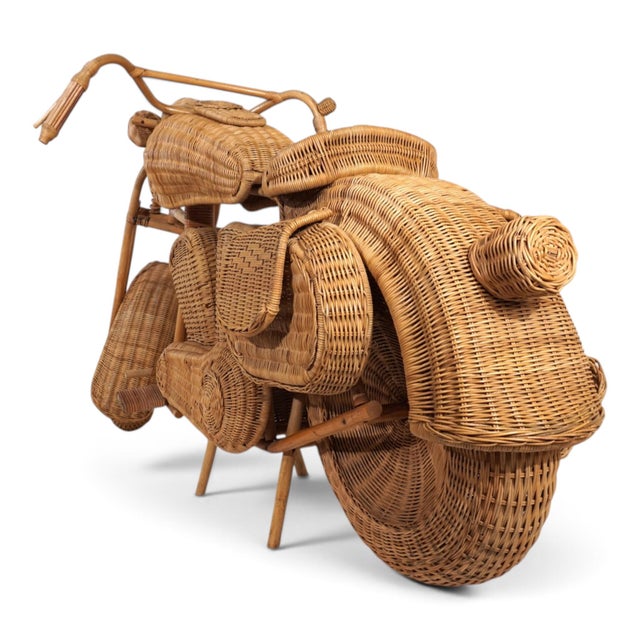 This extraordinary, nearly life-size motorcycle sculpture made of rattan, wicker, and bamboo is attributed to British...