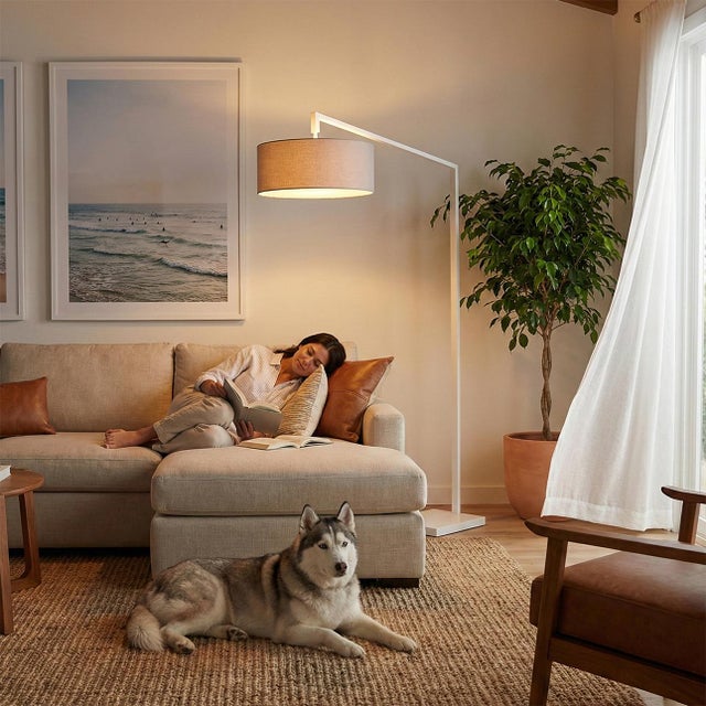 The Stretch Arc Lamp is a modern design by Kirby Groce, featuring a striking architectural silhouette that serves as a...