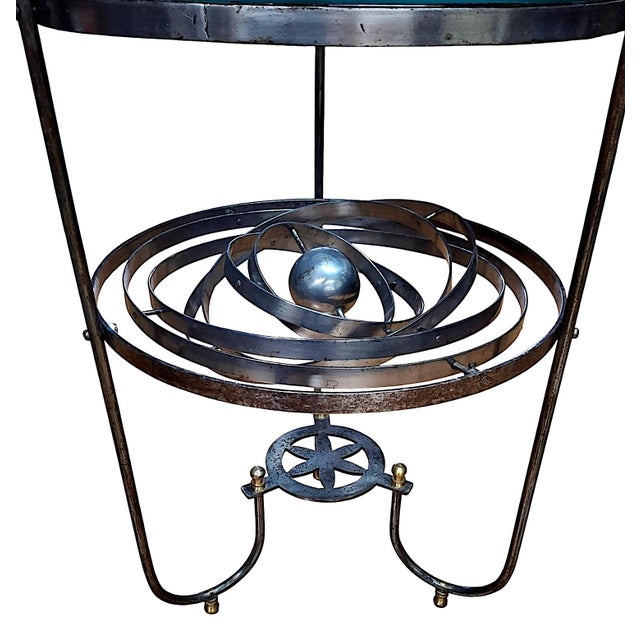 This unique piece of furniture is a mid-century astrolabe-inspired accent table. It seamlessly merges scientific model...
