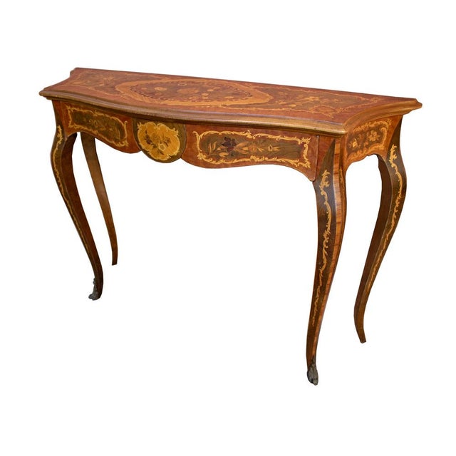 Console table in the Italian Lombard Baroque style, richly inlaid with floral motifs. Complete with two side drawers and...