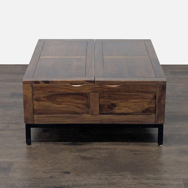 This Crate & Barrel coffee table features a sturdy wood build and a rich, natural finish. The table includes a lift-top...