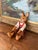 Charming vintage hand-carved wooden rabbit doll, featuring articulated arms and legs with a natural wood finish. The...