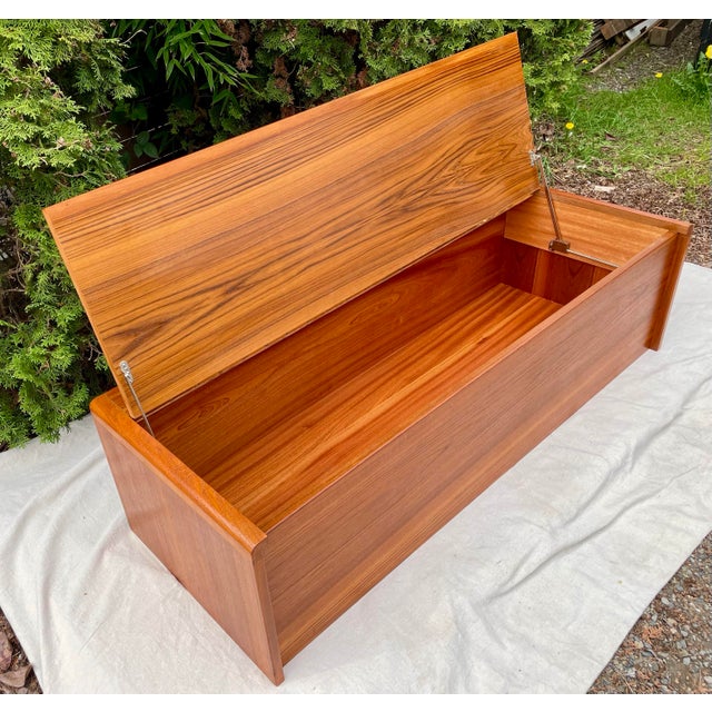 Beautiful mid-century Danish modern blanket chest crafted in richly grained teak with waterfall rounded edges. This piece...