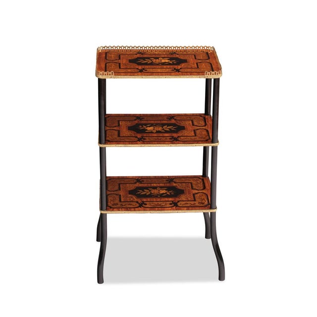 France, late 19th century, rosewood and various precious woods veneered and marquetry with floral motifs, 3 tiers, the...