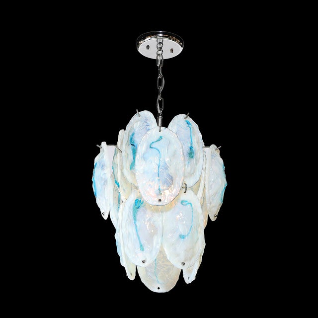This Mid-Century Modernist hand-blown Murano chandelier in opalescent glass with cerulean blue detailing, crafted in Italy...