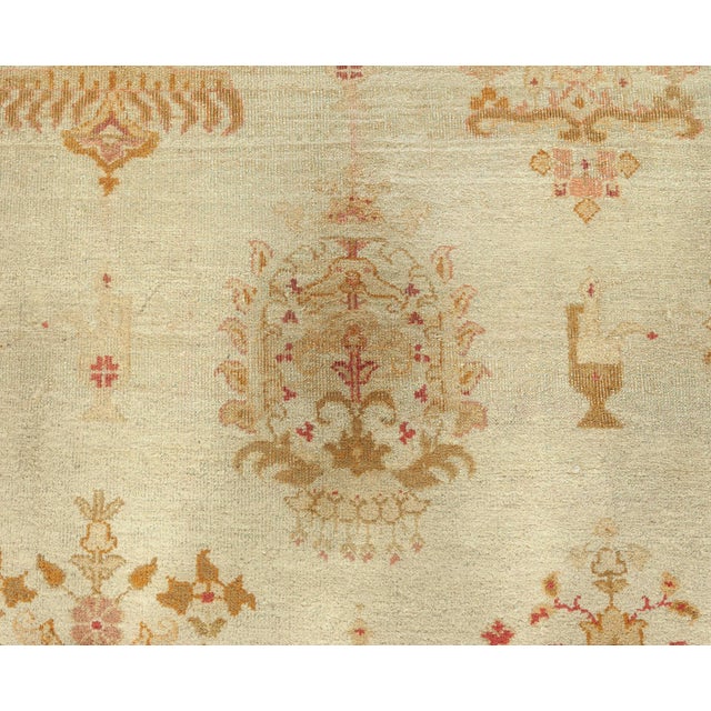 This early 20th century antique Indian Amritsar carpet from Indian area rugs collection features a unique all-over design...