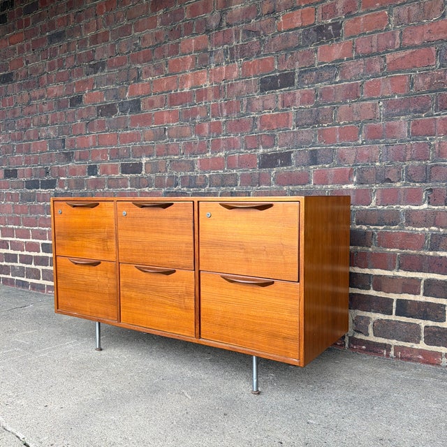 Designed by Jens Risom, this Danish Modern filing cabinet credenza offers exceptional functionality with timeless mid-...