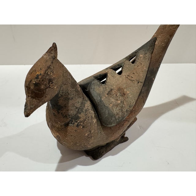 Japanese cast iron bird-form incense burner with an elongated upright tail and pierced back cover. Sculptural mid-century...