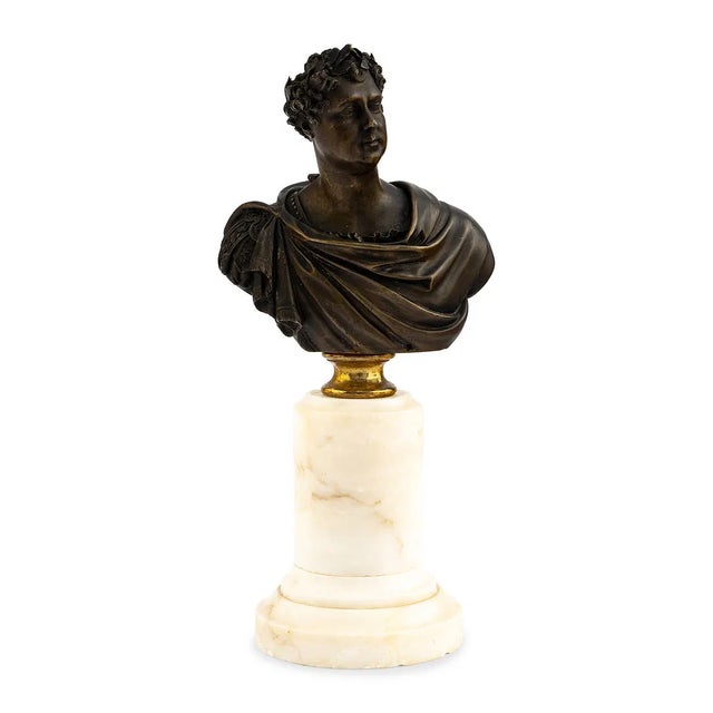 A striking 19th century bronze coronation bust of King George IV, mounted on a turned cream marble pedestal. The finely...