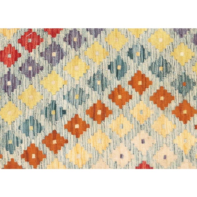 Authentic vintage Afghan Maimana Kilim, skillfully handcrafted with wool-on-wool construction by Northern Afghanistan's...