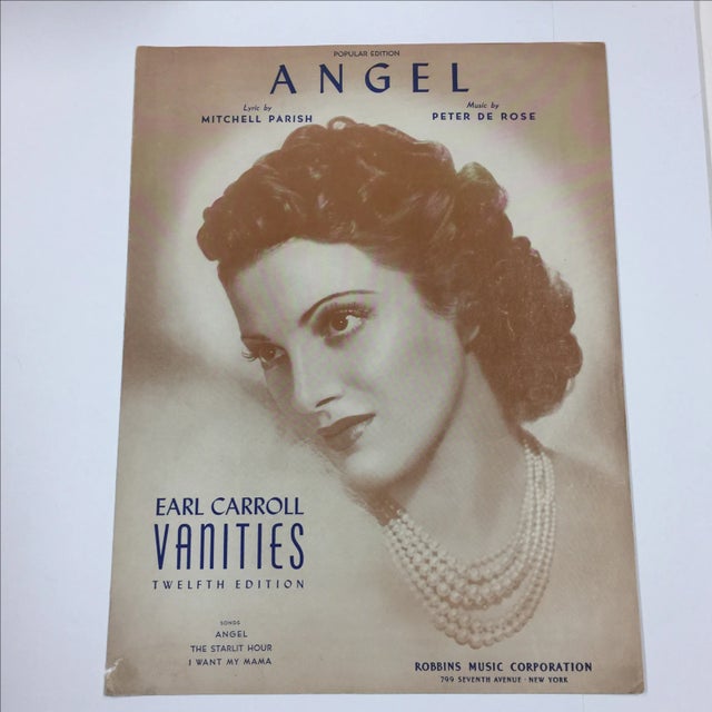 Sheet music featuring a wonderful thirties-style woman with pearls on the cover. Written by Mitchell Parish (lyrics) and...