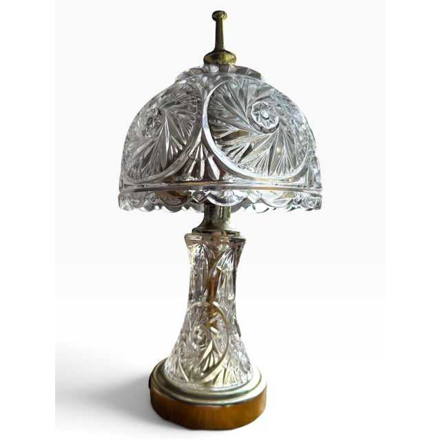Elegant vintage cut-glass boudoir table lamp featuring an intricately patterned clear glass body and matching domed glass...