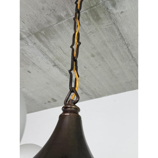 A magnificent statement of Machine Age elegance, this authentic Central European Art Deco chandelier beautifully...
