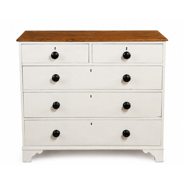 A handsome late Victorian chest of drawers, dating from the late 19th century, beautifully combining a painted pine...