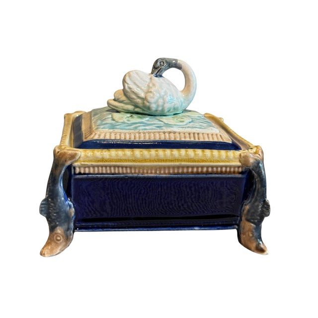 A charming and unusual English majolica sardine box and cover dating to circa 1900. The rectangular vessel is richly...