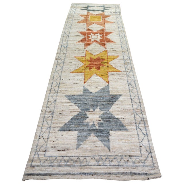 Hand-knotted with care using traditional rug making techniques, this wool rug blends timeless craftsmanship with a modern...