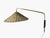This vintage wall lamp, made by Valinte in the 1950s, beautifully combines brass and rattan into a warm and inviting...
