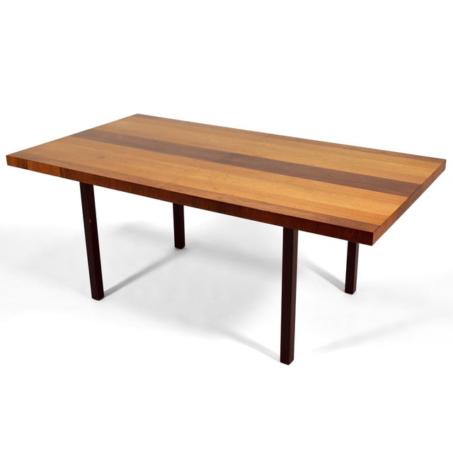 This classic mid-century dining table designed by Milo Baughman for Directional takes a simple, rectilinear form and...