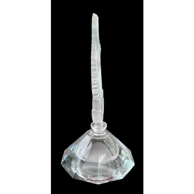 This is a vintage Art Deco faceted crystal perfume bottle, produced in Czechoslovakia (Bohemia). The bottle showcases...