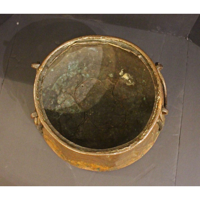 Circa 1900 Arts & Crafts copper & iron cauldron, English. Great iron side straps with swing handles. Battered finish adds...