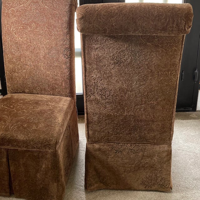 A Regal pair of velvet tapestry chairs in a warm chestnut brown. Full skirting all around lined in crimson red satin...