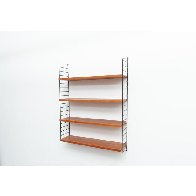 String shelving system with 4 shelves and 2 ladders in walnut Design: Kajsa & Nils "Nisse" Strinning Width 78 cm Height 77...