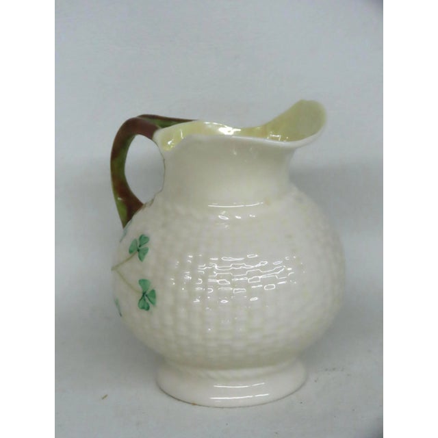 This beautiful Creamer is made of porcelain. This creamer is stamped as being made by Belleek in Ireland. This wonderful...