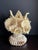 Vintage South Pacific cowrie shell vase, artfully woven with clear fishing line. This large, chunky, hefty vase measures...