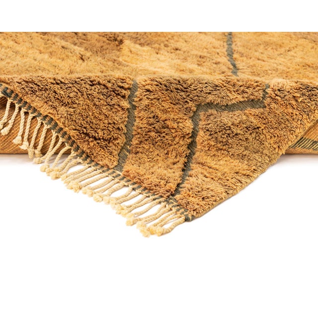 Exquisite hand-knotted rug featuring subtle diamond patterns in shades of Ochre and Medium Brown, exuding sophistication...