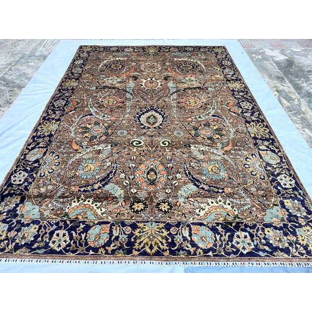 This magnificent hand-knotted wool area rug features an intricate and elegant Isfahan Shah Abbasi design. The main field...
