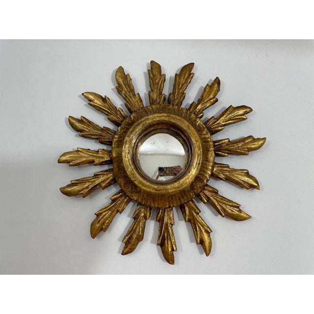 A splendid petite 9.5" vintage French Giltwood Sunburst Convex Wall Mirror from the 1940s. The 2.5" diameter deep set...