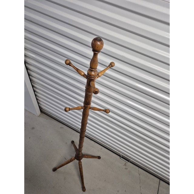This antique coat rack is crafted from oak and features a distinct faux bamboo turned design. Style: Victorian or late...