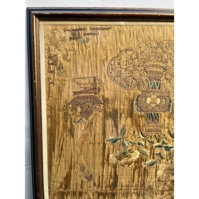 A single large antique Chinese silk embroidery panel featuring auspicious symbols and flowers. Finished with a dark blue...