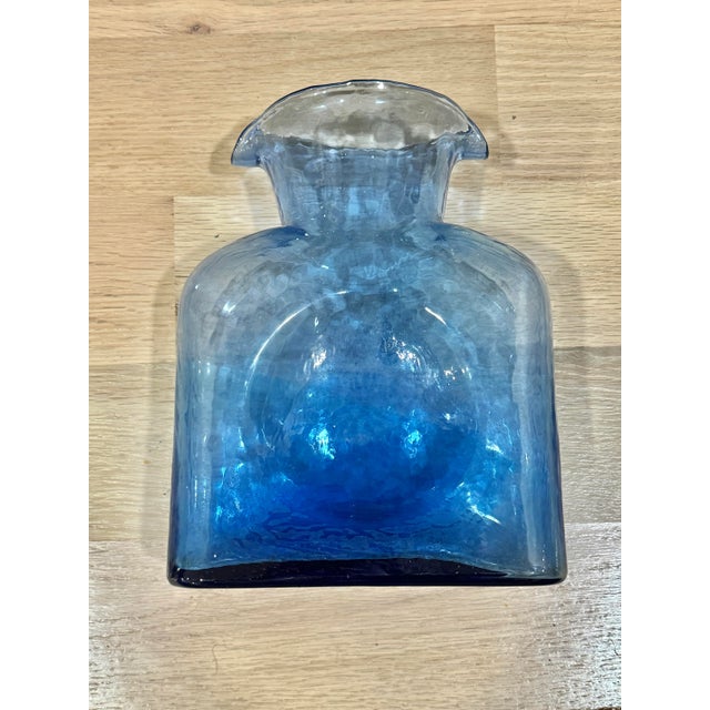 Vintage mcm Blenko glass bottle. Could use it as a carafe or decorative piece. Lovely blue color. Thumbprint indentation...