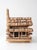 A charming vintage folk art sculpture depicting a rustic woodland log cabin, meticulously handcrafted from natural...