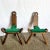 This striking pair of vintage handmade wooden birthing chairs showcases traditional craftsmanship and sculptural artistry....