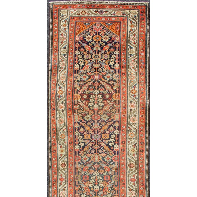 Measures: 3'4 x 13'6 Antique Persian Malayer Runner with Colorful Allover Botanical Design. Keivan Woven Arts / rug...