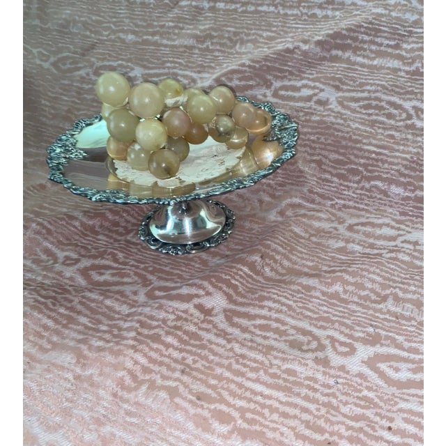 Elevate your next gathering or holiday dessert table with this exquisite vintage silverplated pedestal cake stand by the...