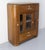 This French cabinet in massive teck with glass vitrine two drawers and two doors is very original with its rounded...