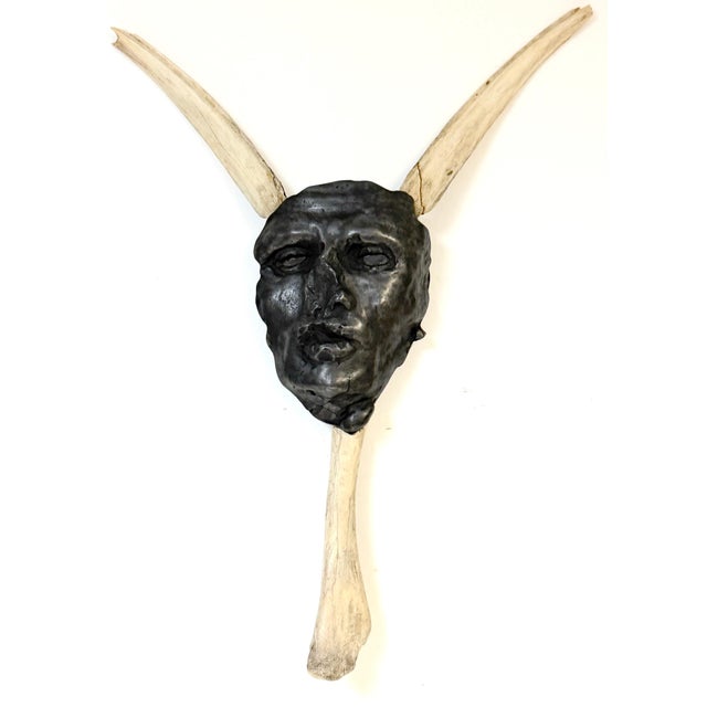 Tribal Mask Wall Sculpture by China Marks, American, b 1942 This powerful wall-mounted sculpture is a work by China Marks....