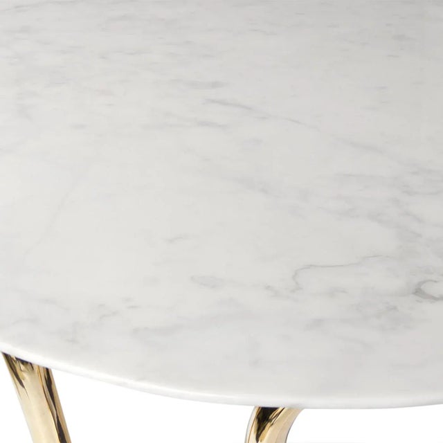 Our sinuous bent brass base topped with a white Carrara marble top. As intoxicating as its namesake, our Scalinatella...