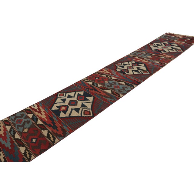 These flatweaves are a pair of twin 3x17 vintage Persian Kilim runner rugs, handwoven in wool circa 1950-1960. These...