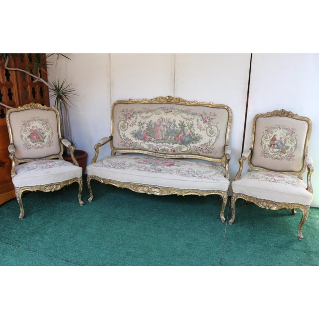 Amazing set of two chairs and a sofa original from the 19th Century. This sofa and chairs embodies the opulent Rococo...