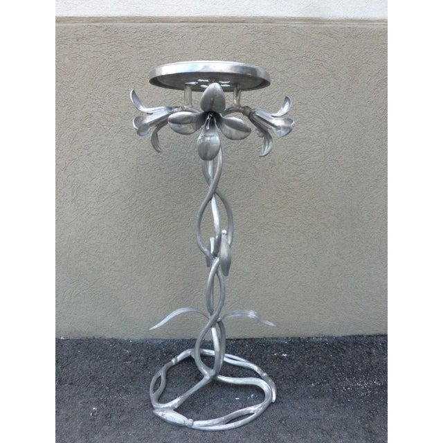 This is a vintage Kessler aluminum flower power mod lily stand. The piece is from the 1970s.