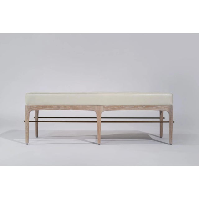 The Linear Bench is a refined take on mid-century modern design inspired by Edward Wormley with a sleek silhouette...