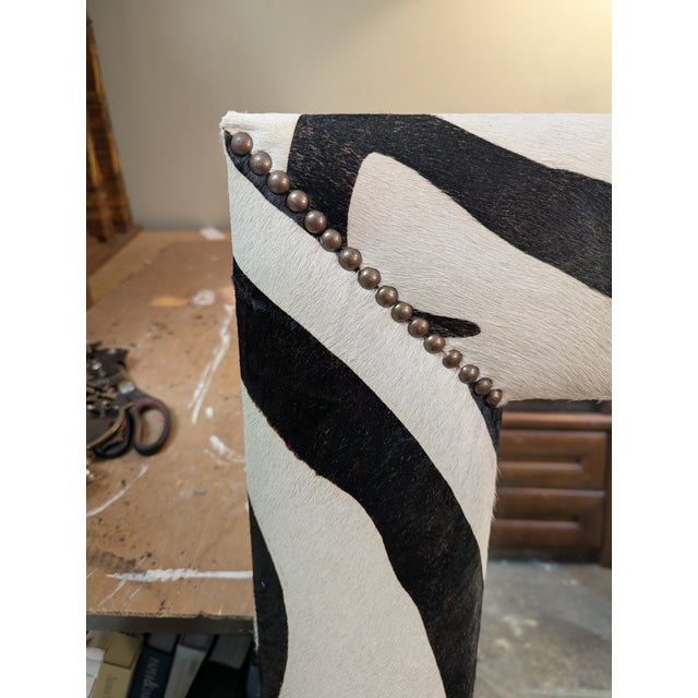 Cowhide framed mirror printed with a Zebra Print. Accented in the corners with antique brass nail heads. Can be hung...